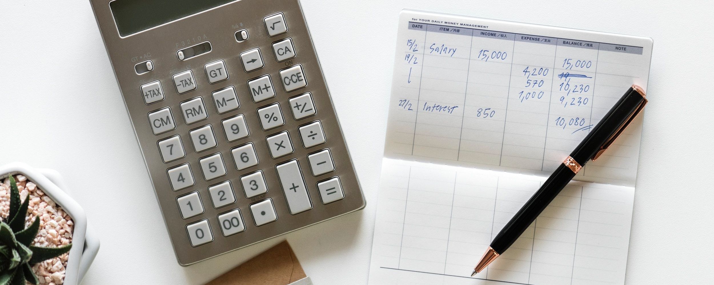 calculator, pen, notepad, money plan.jpg